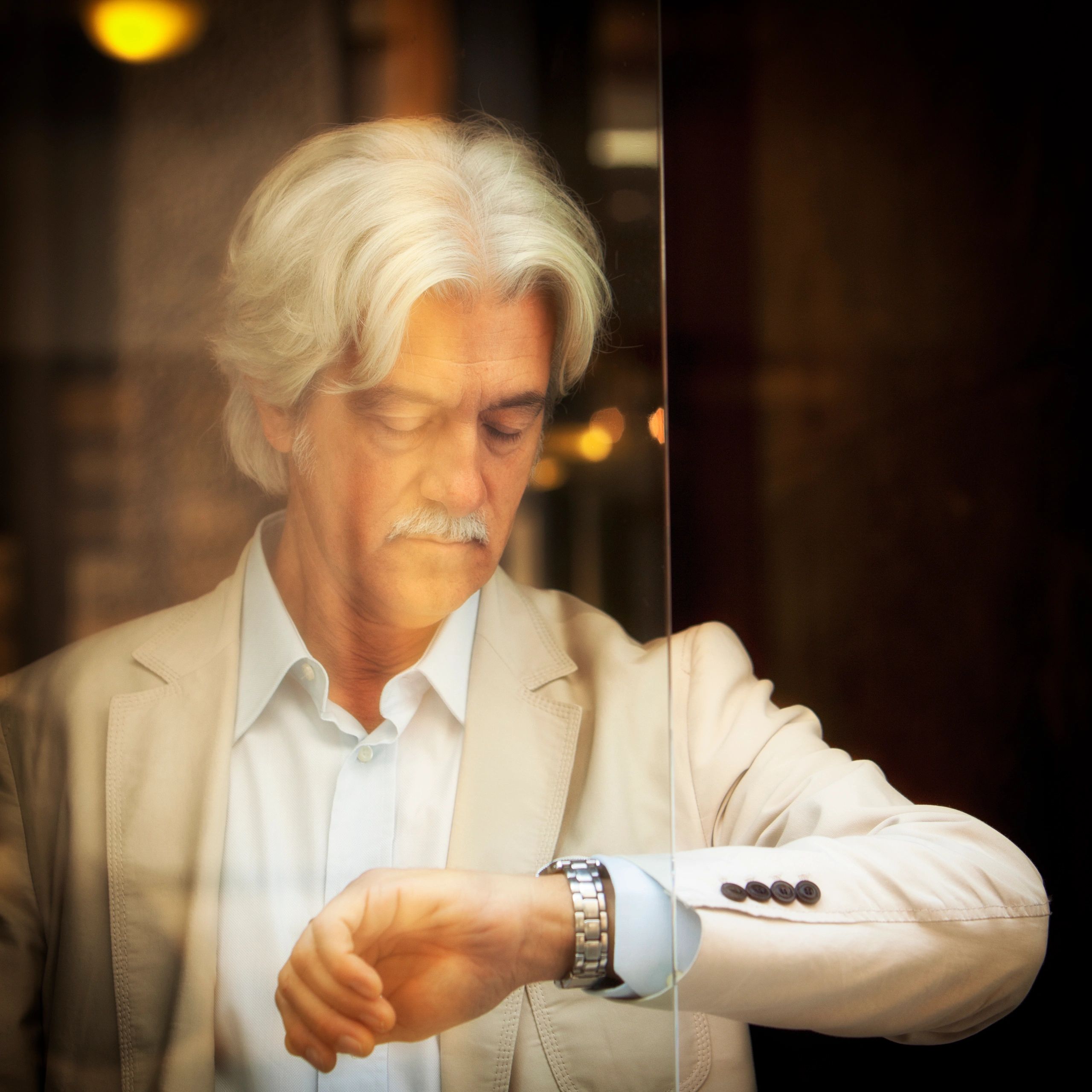 Portrait of a collector wearing a suit