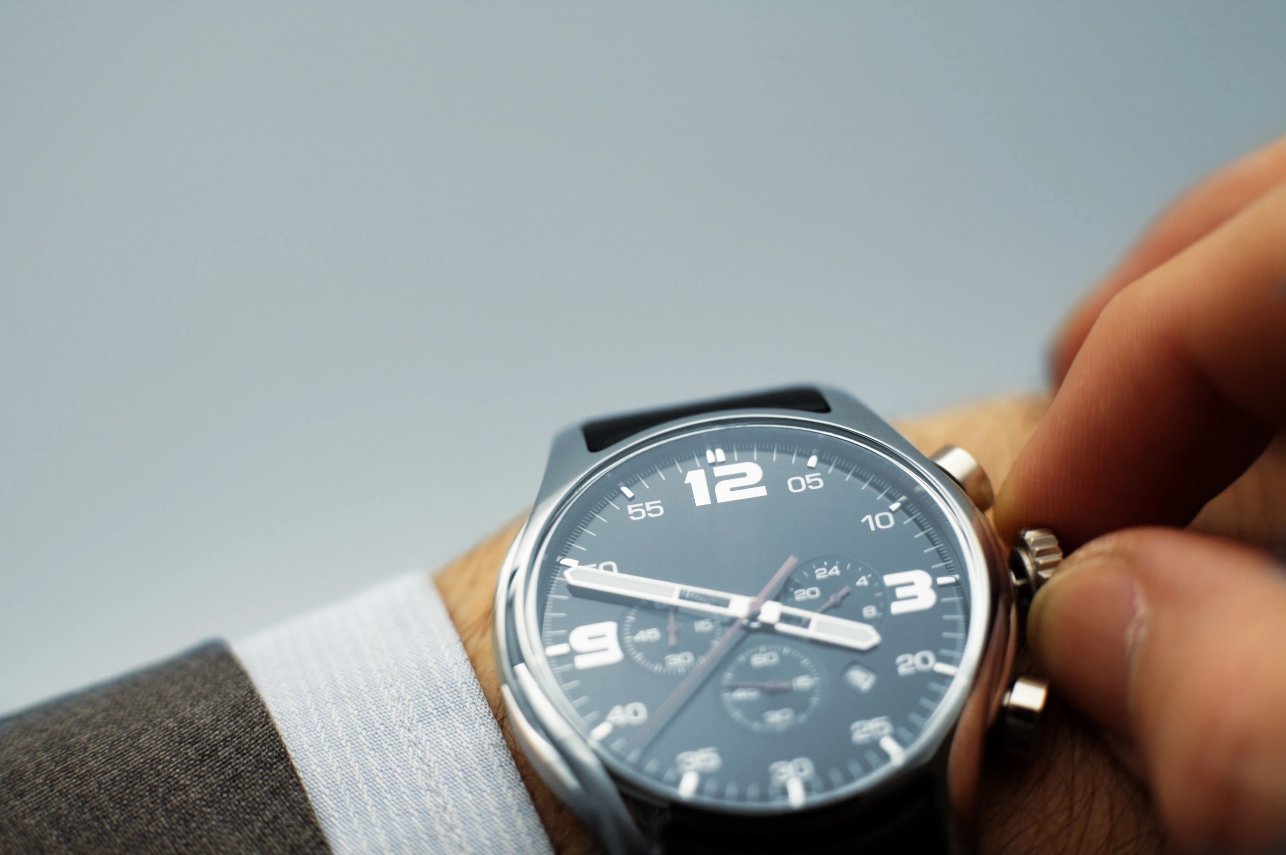Close-up of a refined watch dial and crown