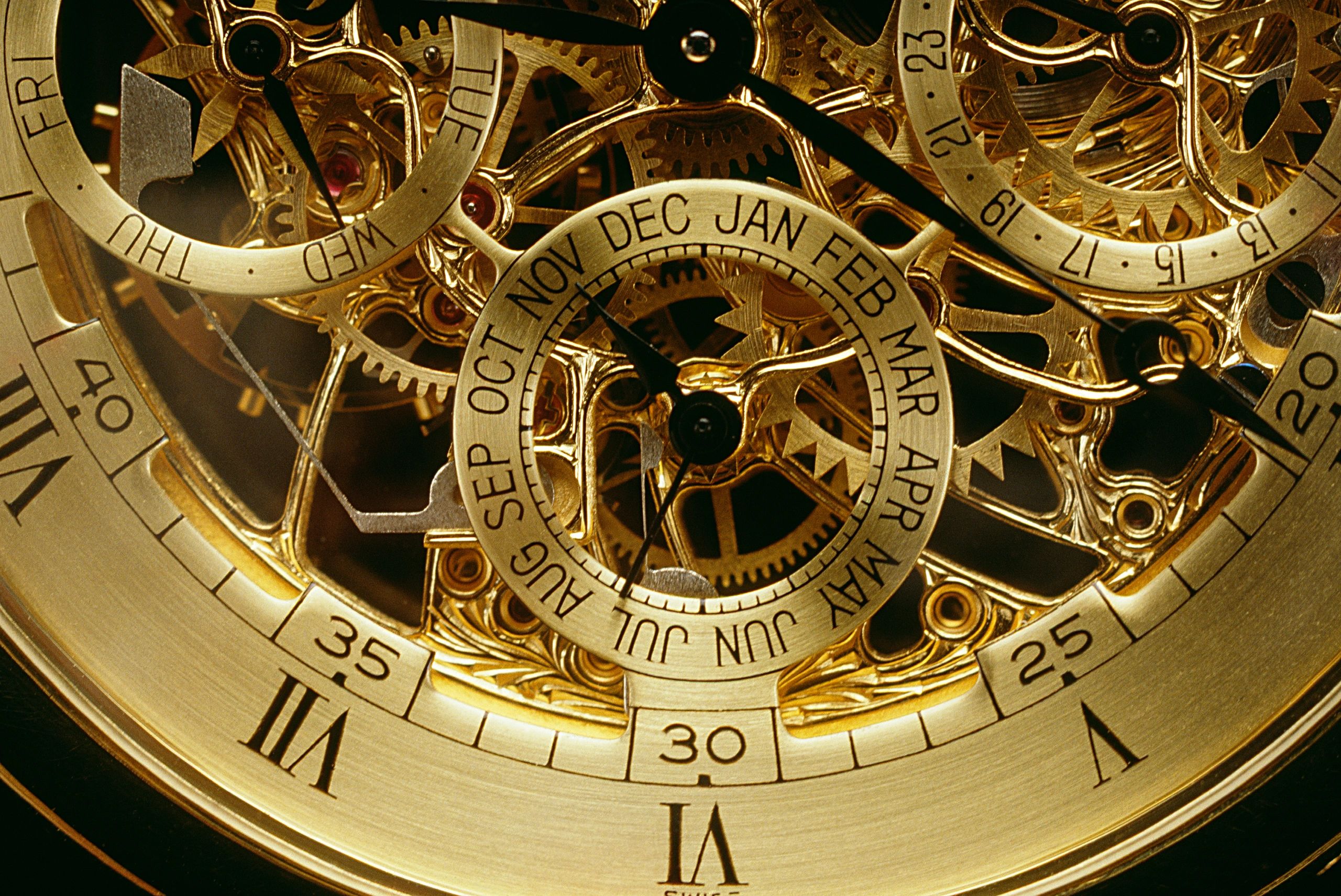 Macro orange-gold watch movement detail