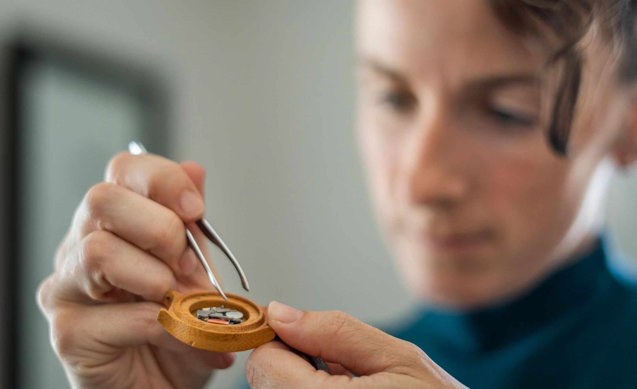 Watchmaker repairing a wristwatch close-up